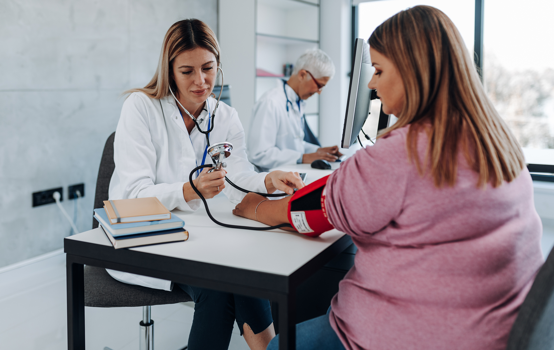 Woman speaking to doctor